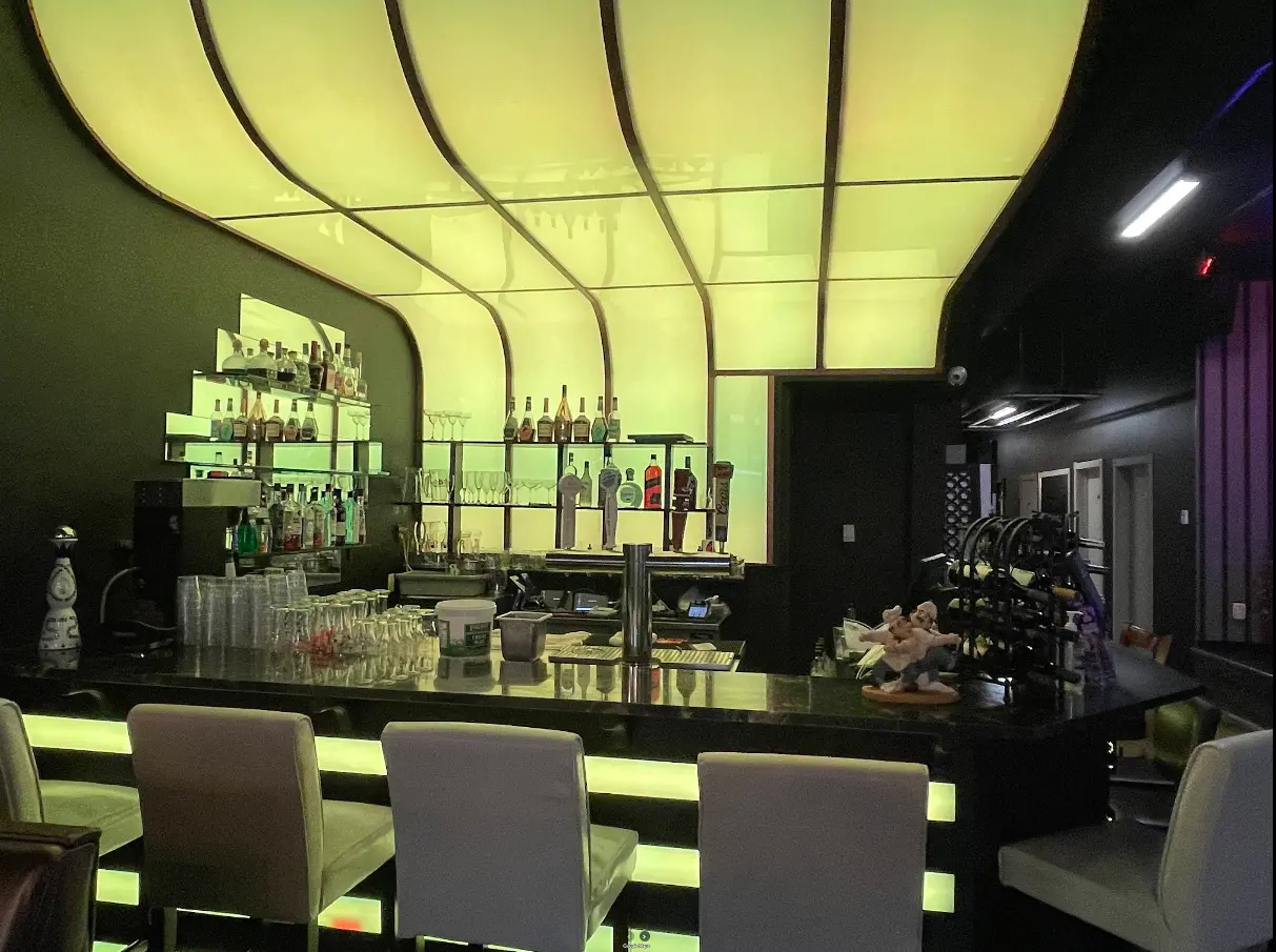 Daawat Authentic Multi Kitchen & Bar Indian restaurant interior - Art-lined dining room on Whyte Ave Edmonton