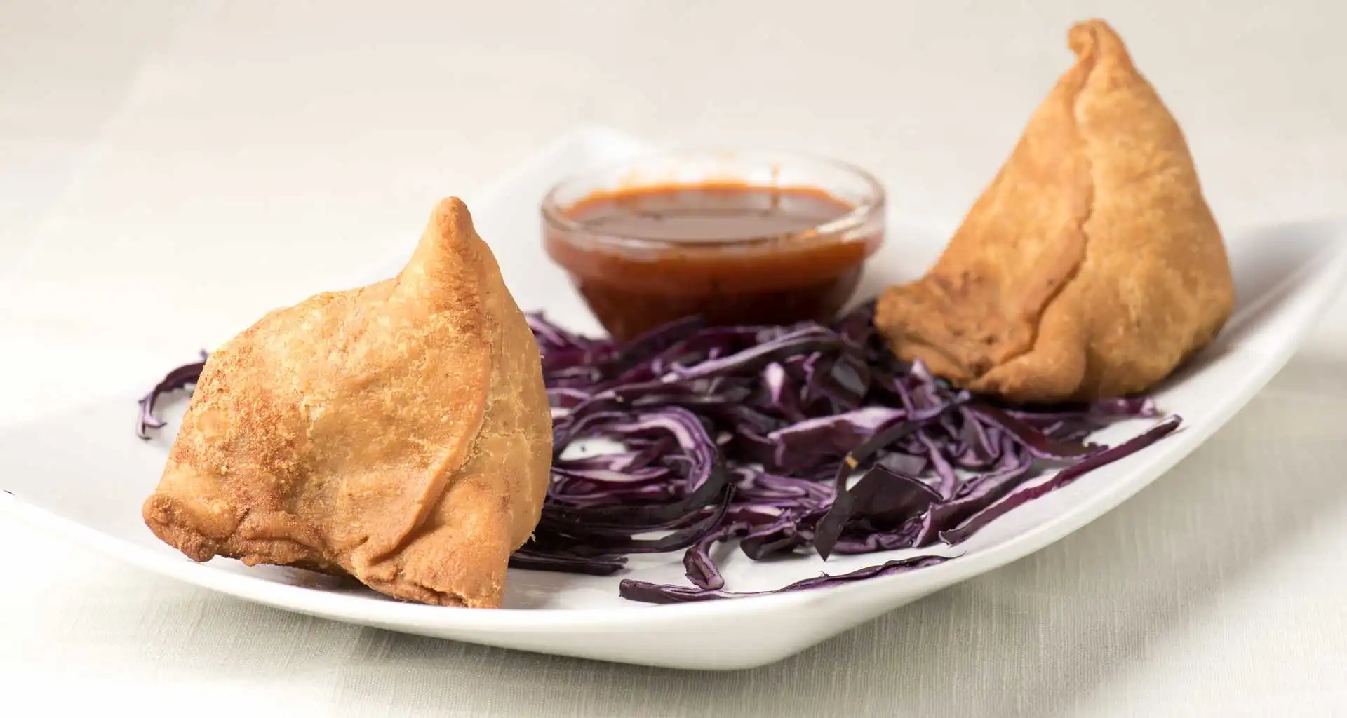 Samosas - Crispy Indian appetizer at Daawat Authentic Multi Kitchen & Bar Whyte Ave Edmonton